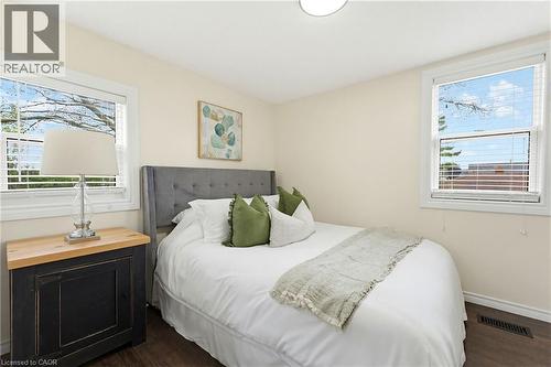 Interior room featuring light-toned walls, wood-finish flooring, and white trim - 60 Avenue Road, Cambridge, ON - Indoor Photo Showing Bedroom