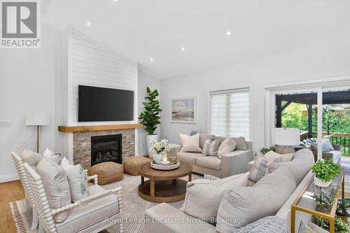 15 Pinecone Avenue, Tiny, ON - Indoor Photo Showing Living Room With Fireplace