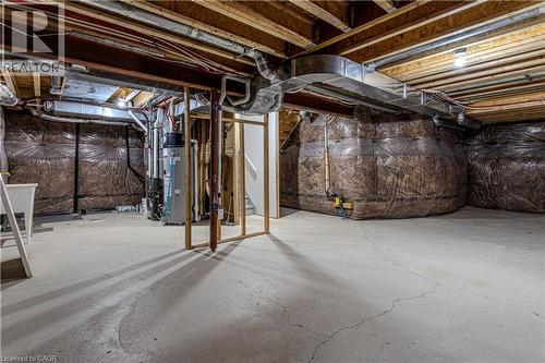 Unfinished basement with concrete flooring, exposed wood joists, and visible utility infrastructure, including ductwork and plumbing - 3896 Tufgar Crescent, Burlington, ON - Indoor Photo Showing Basement