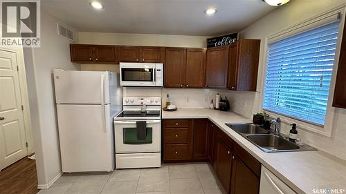 807 107Th Avenue, Tisdale, SK - Indoor Photo Showing Kitchen With Double Sink