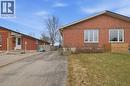 View of property exterior with a yard, brick siding, entry steps, and driveway - 7 Forest Drive, Paris, ON  - Outdoor With Exterior 