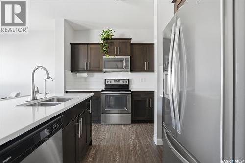4810 Green Brooks Way E, Regina, SK - Indoor Photo Showing Kitchen With Stainless Steel Kitchen With Double Sink With Upgraded Kitchen