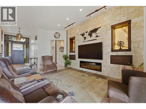 2200 Cortina Drive, Kelowna, BC - Indoor Photo Showing Living Room With Fireplace