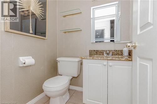 Half bathroom featuring vanity and light tile patterned flooring - 32 Vineberg Drive, Hamilton, ON - Indoor Photo Showing Bathroom