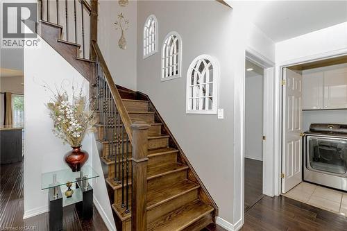 Stairway with washer / clothes dryer and wood finished floors - 32 Vineberg Drive, Hamilton, ON - Indoor