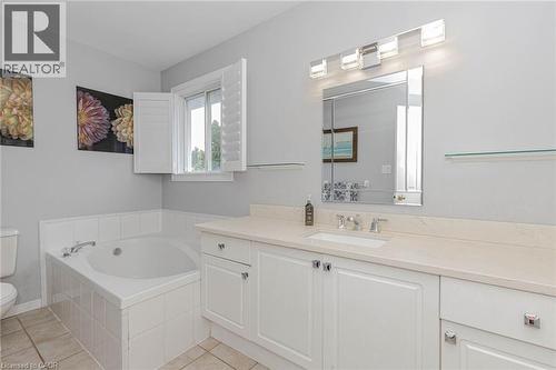 Bathroom featuring vanity, light tile patterned floors, and a garden tub - 32 Vineberg Drive, Hamilton, ON - Indoor Photo Showing Bathroom