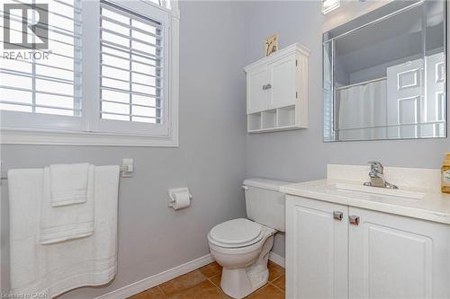 Bathroom featuring vanity, curtained shower, and light tile patterned floors - 32 Vineberg Drive, Hamilton, ON - Indoor Photo Showing Bathroom