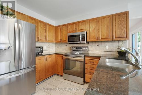 Double sink in island, built in microwave - 41 Framingham Crescent, Ottawa, ON - Indoor Photo Showing Kitchen With Double Sink