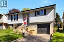 Split-level exterior featuring light-colored siding and brick accents - 16 Sandlewood Avenue, Brantford, ON  - Outdoor 