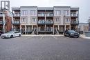 Modern townhome exteriors featuring multi-level balconies with glass railings - 25 Isherwood Avenue Unit# G-105, Cambridge, ON  - Outdoor With Facade 