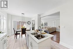 Open concept kitchen/family/dining area. - 