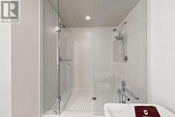 Over sized glass shower with his and hers faucets. - 