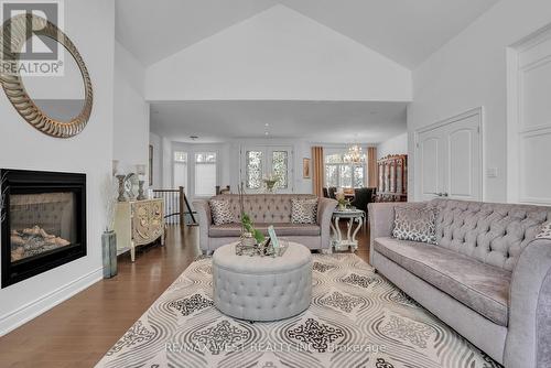 2 Sycamore Circle, Springwater, ON - Indoor Photo Showing Living Room With Fireplace