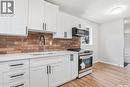 53 Rita Crescent, Saskatoon, SK  - Indoor Photo Showing Kitchen With Double Sink 