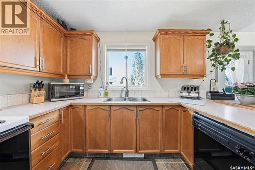 218 Ward Court, Saskatoon, SK - Indoor Photo Showing Kitchen With Double Sink
