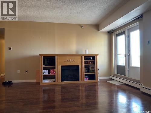 904 405 5Th Avenue N, Saskatoon, SK - Indoor Photo Showing Other Room With Fireplace