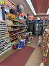 Retail space with tiled flooring and ample display shelving - 1 King Street E, Hamilton, ON 