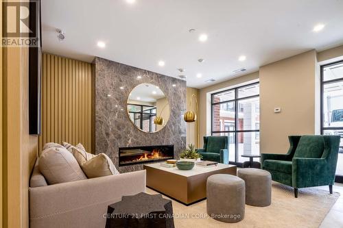 204 - 1975 Fountain Grass Drive, London South (South B), ON - Indoor With Fireplace