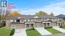 Contemporary townhome exterior featuring a combination of light-colored siding and stone veneer - 5 Davinci Boulevard, Hamilton, ON  - Outdoor With Balcony With Facade 