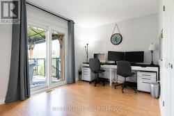 Bedroom, being used as office space. Patio doors. - 