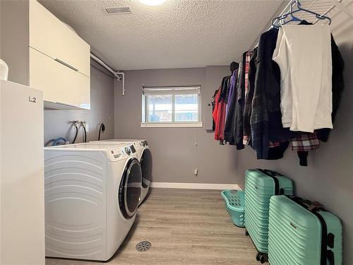 Laundry Room with Newer Washer/Dryer - 12 Dominion Way, Brandon, MB - Indoor Photo Showing Laundry Room