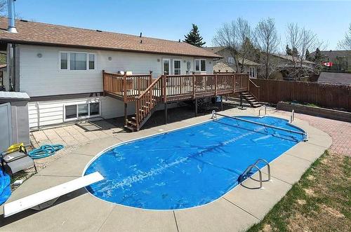 In-ground Pool - 12 Dominion Way, Brandon, MB - Outdoor With In Ground Pool With Deck Patio Veranda