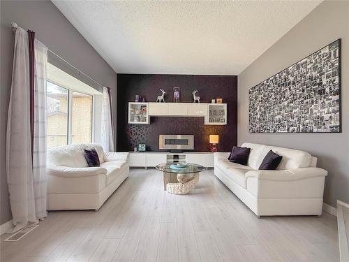Lots of Natural Light - 12 Dominion Way, Brandon, MB - Indoor Photo Showing Living Room With Fireplace