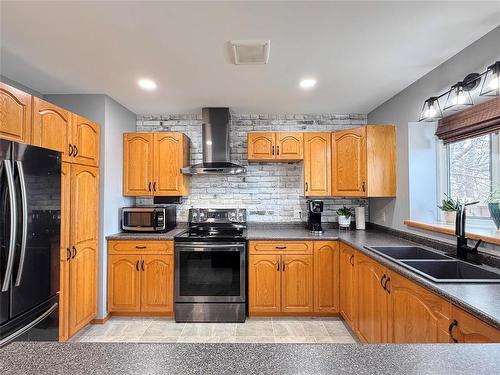 Newer Appliances & Hood Fan - 12 Dominion Way, Brandon, MB - Indoor Photo Showing Kitchen With Double Sink