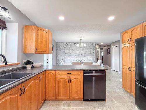 Tons of Cabinetry - 12 Dominion Way, Brandon, MB - Indoor Photo Showing Kitchen With Double Sink