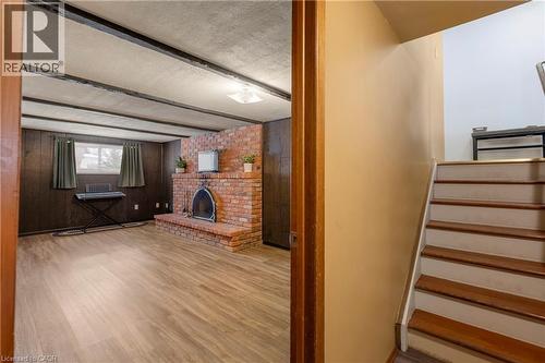 401 Mohawk Road W, Hamilton, ON - Indoor Photo Showing Other Room With Fireplace