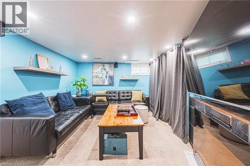 Recreational room featuring recessed lighting, a neutral carpet, floating wall shelves, and light-filtering window treatments - 242 East 43Rd Street, Hamilton, ON - Indoor