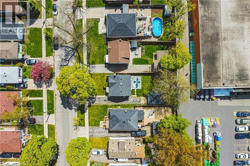 Aerial perspective showcasing a residential street with detached homes and green spaces - 242 East 43Rd Street, Hamilton, ON - Outdoor With View