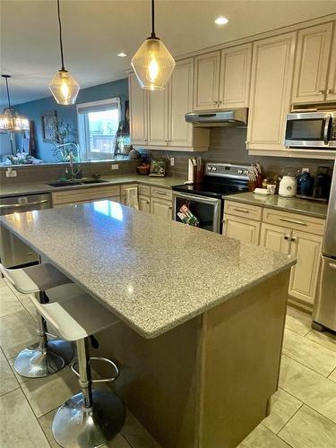 Upgraded Quartz counter tops & Back Splash - 2 Birchwood Drive, Brandon, MB - Indoor Photo Showing Kitchen With Double Sink
