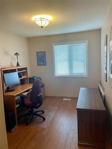 Second main floor bedroom currently used as a office - 10 Falcon Place, Brandon, MB 