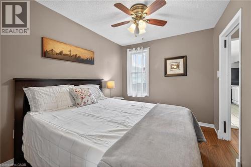 Interior room featuring wood-finish flooring, neutral wall tones, and white trim - 190 Campbell Avenue, Hamilton, ON - Indoor Photo Showing Bedroom