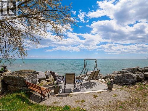 Waterfront outdoor concrete patio featuring magnificent view of Lake Erie. - 1395 Lakeshore Road, Haldimand County, ON - Outdoor With Body Of Water With View