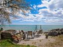 Waterfront outdoor concrete patio featuring magnificent view of Lake Erie. - 1395 Lakeshore Road, Haldimand County, ON  - Outdoor With Body Of Water With View 