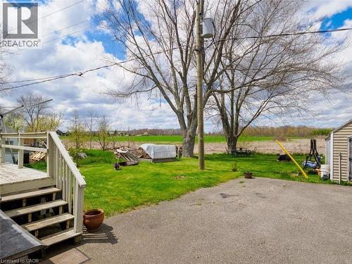 Back yard overlooking creek and two mature trees.  Great space for family gatherings.  Paved drive and two sheds. - 1395 Lakeshore Road, Haldimand County, ON - Outdoor