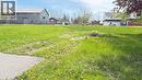 Spacious green lot featuring varied grass and visible ground patches - 6 Brydges Street, Paris, ON 