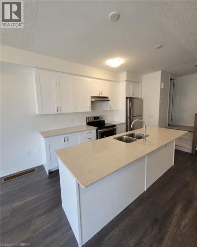 585 Colborne Street E Unit# 913, Brantford, ON - Indoor Photo Showing Kitchen With Double Sink