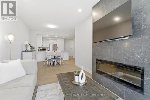 506 - 71 Wyndham Street S, Guelph, ON - Indoor Photo Showing Living Room With Fireplace