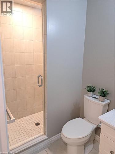 Glass-enclosed shower with subway tile surround and grid pattern floor - 26 Wheat Lane, Kitchener, ON - Indoor Photo Showing Bathroom