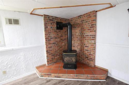 Basement Rec Room freestanding Propane Stove - 77 Guymer Crescent, The Pas, MB -  Photo Showing Other Room