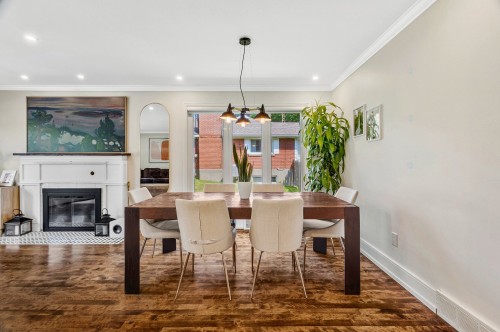 Salle à manger - 133 Av. Madsen, Beaconsfield, QC - Indoor Photo Showing Dining Room With Fireplace