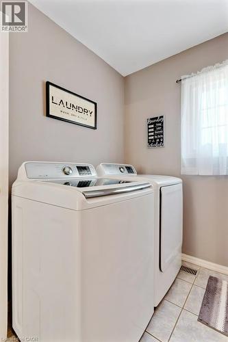 Tiled flooring with neutral wall tones - 236 Winston Boulevard, Cambridge, ON - Indoor Photo Showing Laundry Room