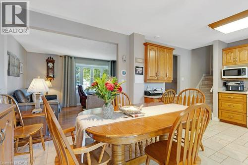 Recessed lighting, wood-finish cabinetry, tile flooring, and wood-finish flooring - 236 Winston Boulevard, Cambridge, ON - Indoor Photo Showing Dining Room