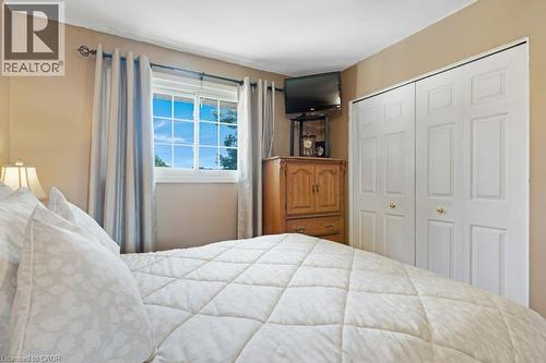 Double bi-fold closet doors with panel detailing - 236 Winston Boulevard, Cambridge, ON - Indoor Photo Showing Bedroom