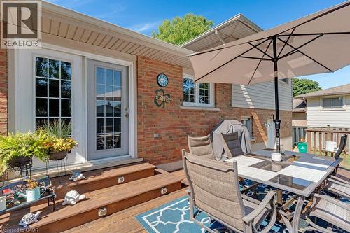 Expansive outdoor deck with integrated step lighting and direct patio door access - 236 Winston Boulevard, Cambridge, ON - Outdoor With Deck Patio Veranda