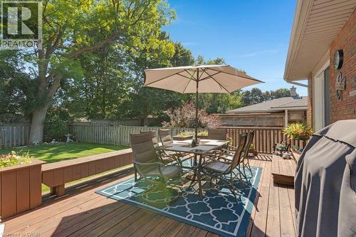 Expansive wooden deck featuring built-in planters and brick exterior - 236 Winston Boulevard, Cambridge, ON - Outdoor With Deck Patio Veranda