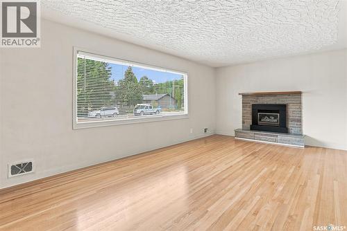 2409 York Avenue, Saskatoon, SK - Indoor Photo Showing Living Room With Fireplace